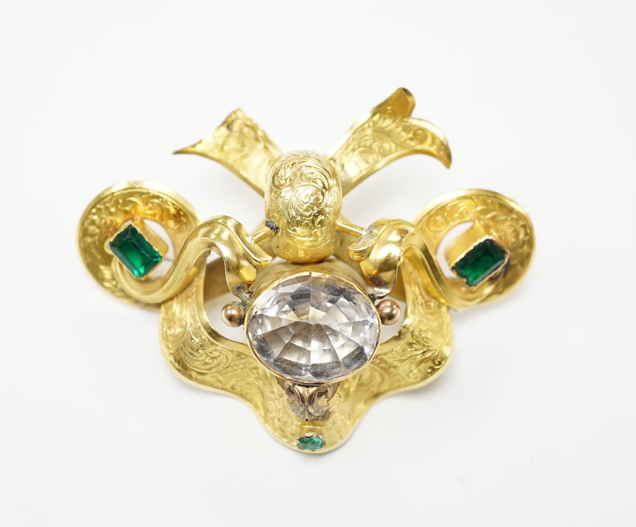 A Victorian engraved yellow metal and foil backed rock crystal and green stone set brooch, width 67mm, gross weight 16.8 grams (a.f.)